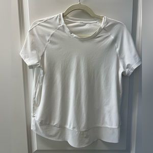 Like new white Lulu Lemon split back shirt with sheer edge. Size 6